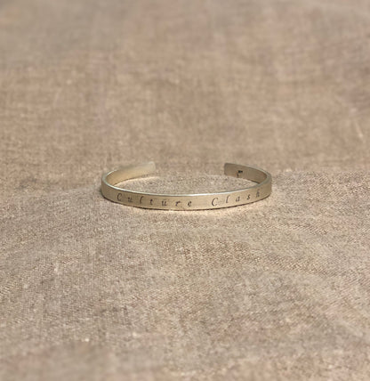CULTURE CLASH CUFF (no image)